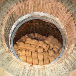 Aging Tuscan Pecorino Cheese in a cave