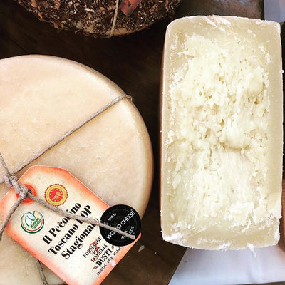 Aging Tuscan Pecorino Cheese in a cave